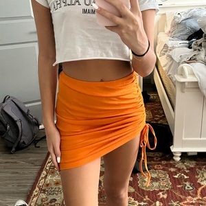 orange mini skirt